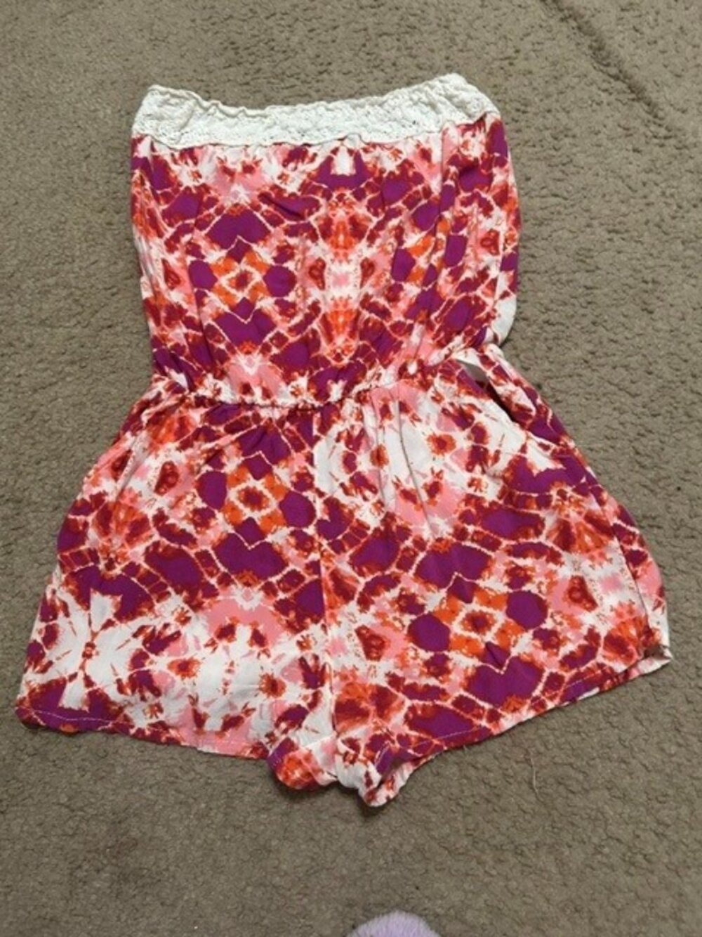 Charlotte Rouse strapless romper with magenta and orange tie-dye pattern.(S)